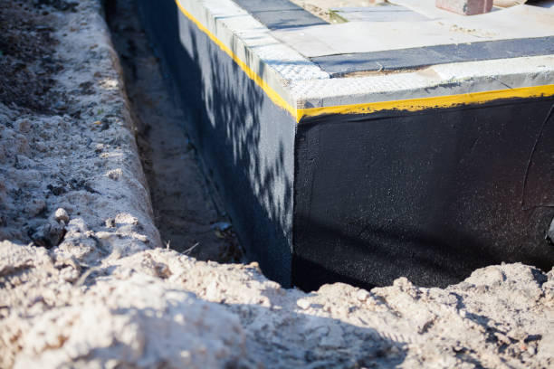 Professional Waterproofing technician working in Holton, KS